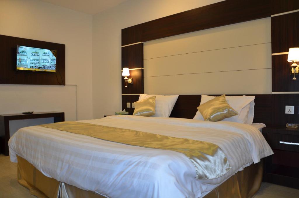 Postel nebo postele na pokoji v ubytování Jazan Heart Hotel