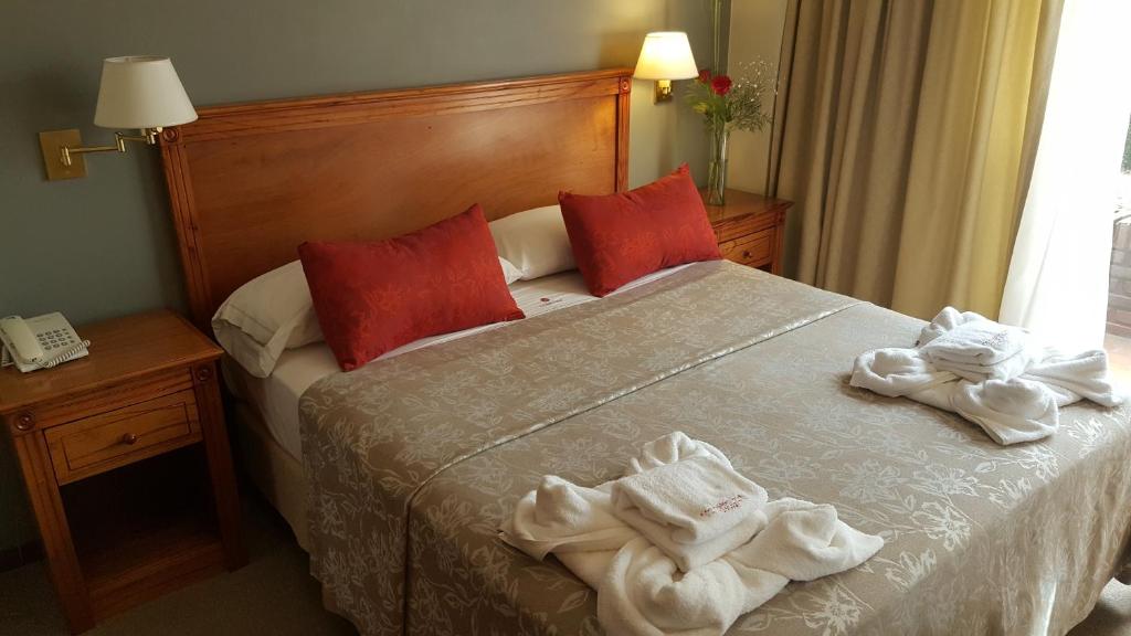 Ένα ή περισσότερα κρεβάτια σε δωμάτιο στο Hotel Corregidor