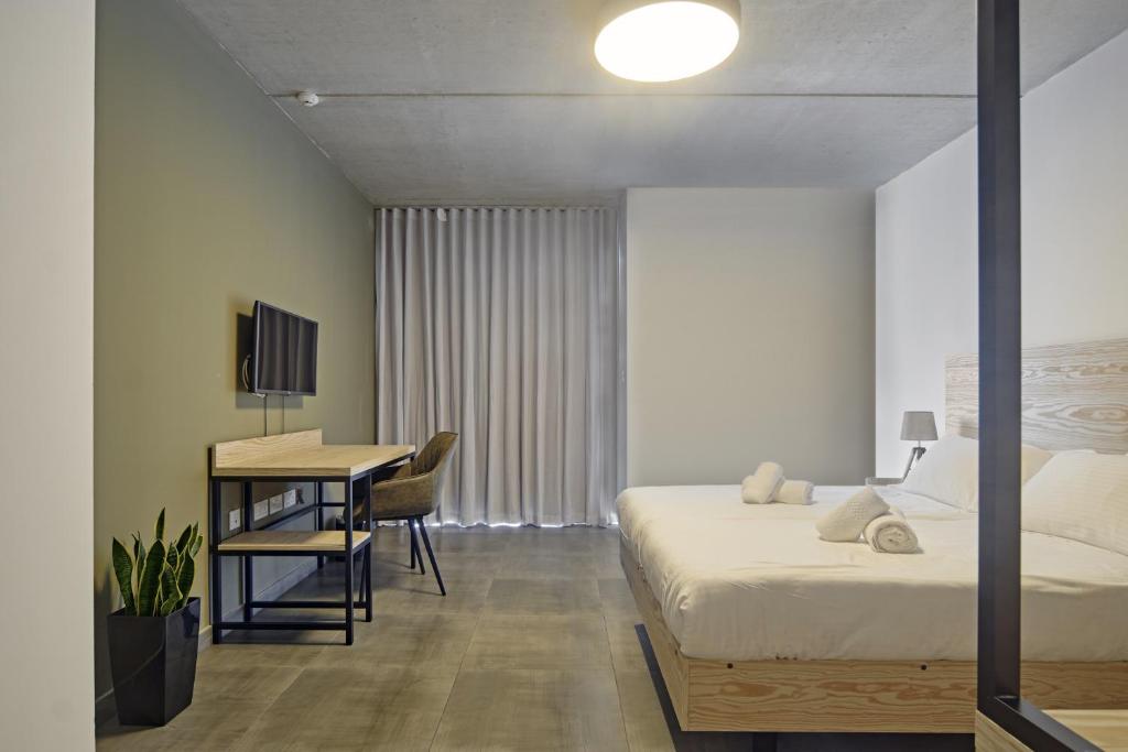 Postel nebo postele na pokoji v ubytování Mr Todd Hotel