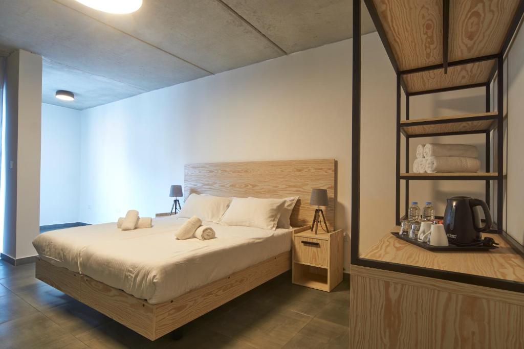 Postel nebo postele na pokoji v ubytování Mr Todd Hotel