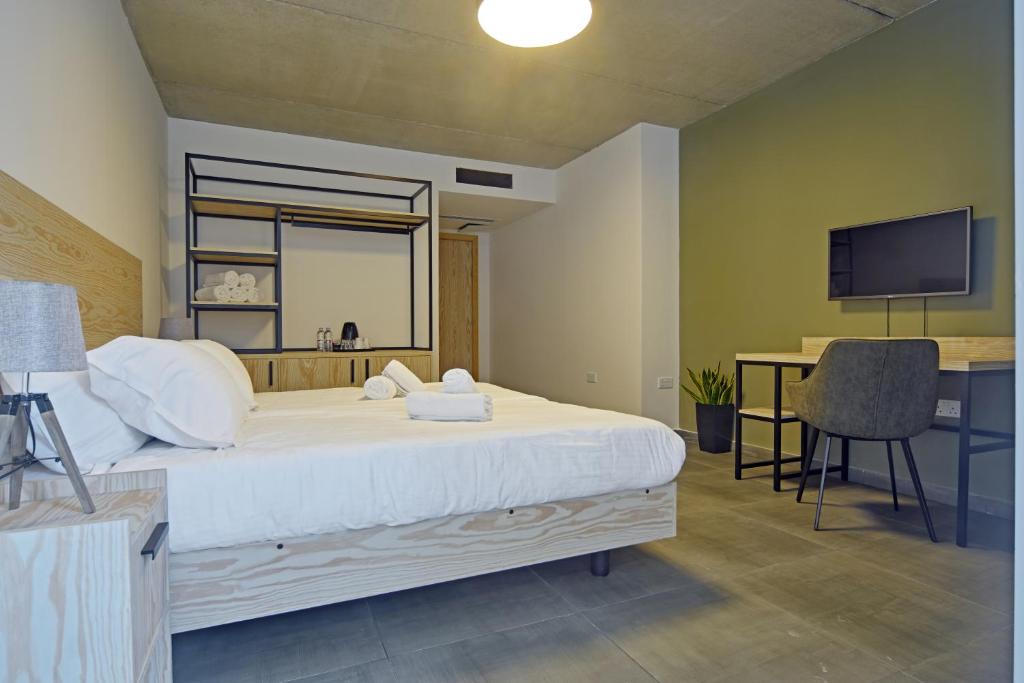 Postel nebo postele na pokoji v ubytování Mr Todd Hotel