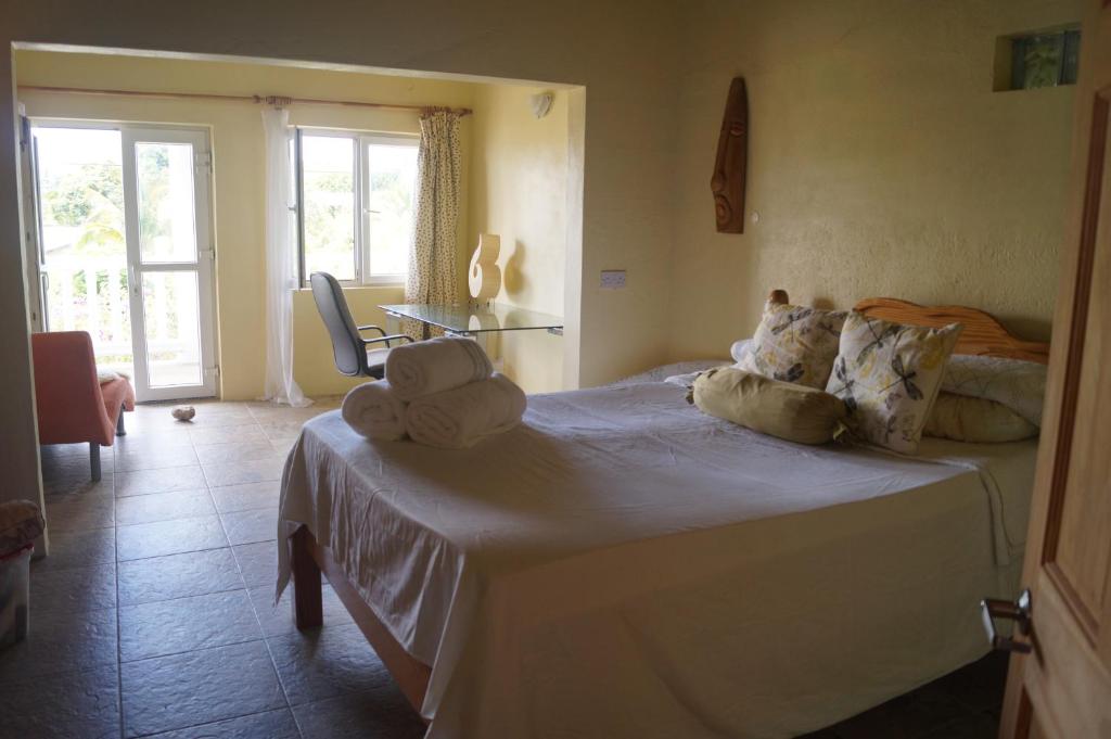 Postel nebo postele na pokoji v ubytování A Private Room in Paradise, Vieux Fort