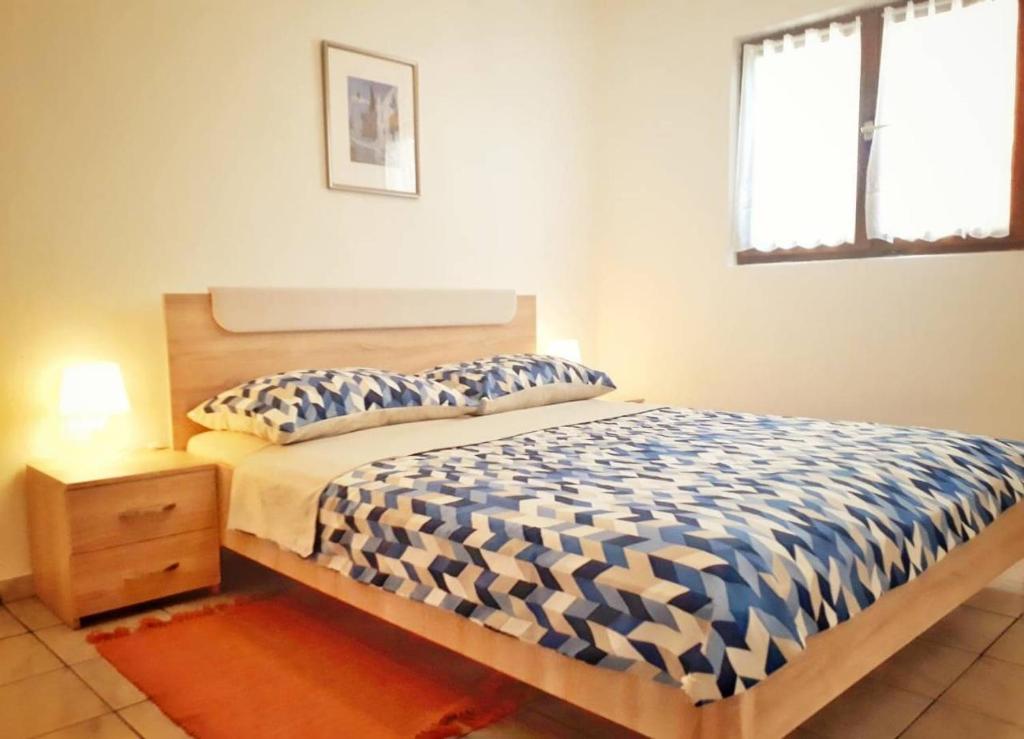 Llit o llits en una habitació de Apartmani Mia