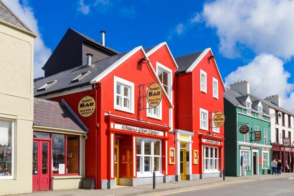 a row of colorful buildings on a street at Dingle Bay Hotel in Dingle