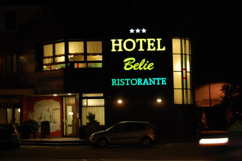 a hotel building with a car parked in front of it at Hotel Belie in San Martino di Lupari