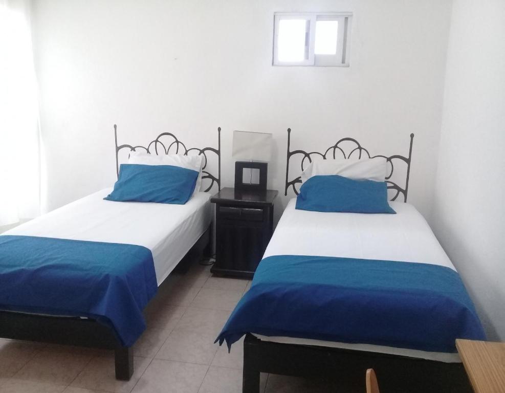 Letto o letti in una camera di Posada San Cristobal