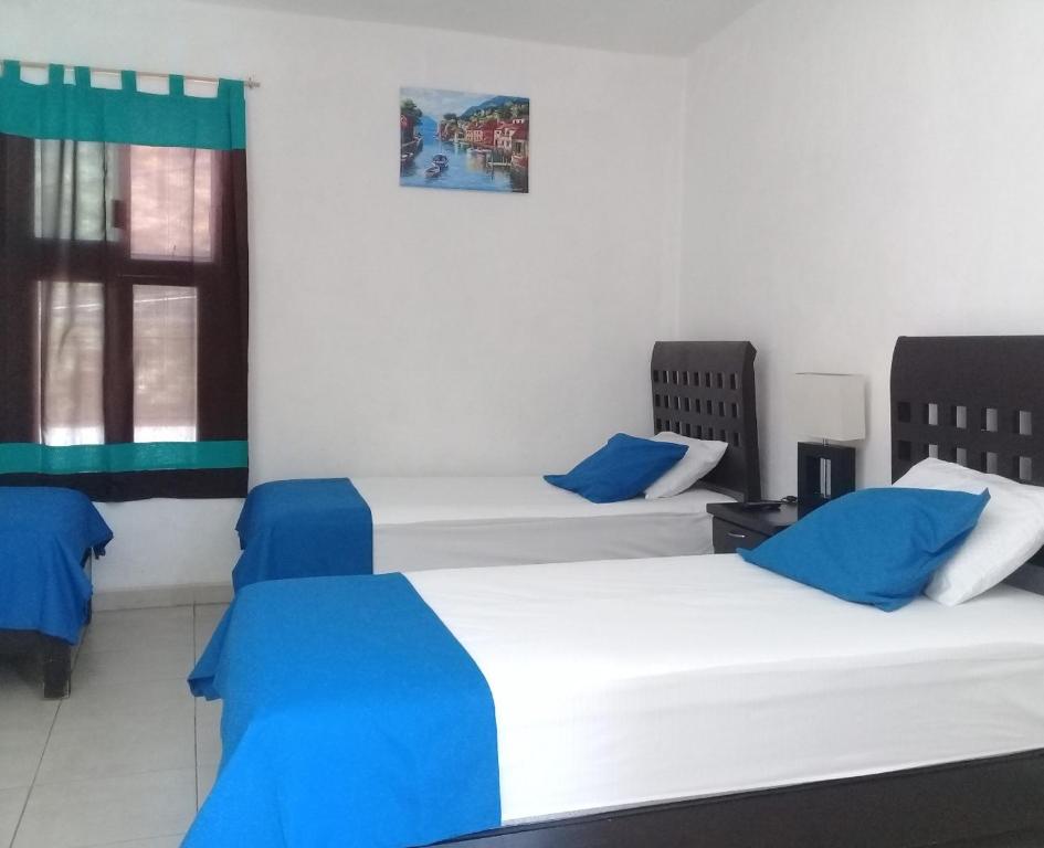 Letto o letti in una camera di Posada San Cristobal