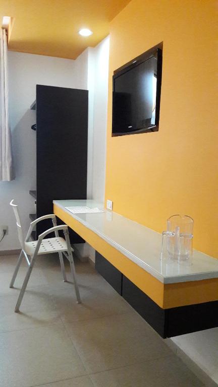 TV a/nebo společenská místnost v ubytování Nu Hotel