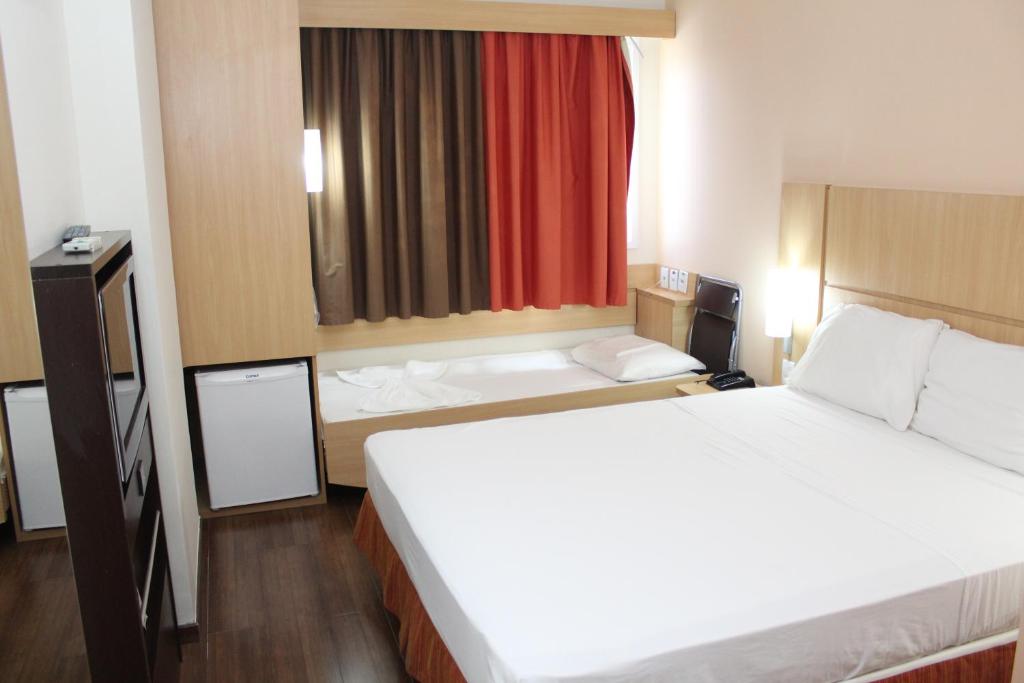 Postel nebo postele na pokoji v ubytování ibis Feira de Santana