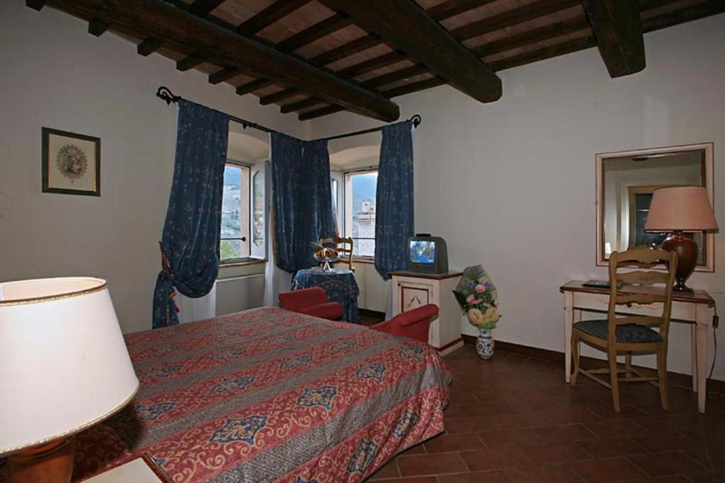 Postel nebo postele na pokoji v ubytování Antica Dimora alla Rocca