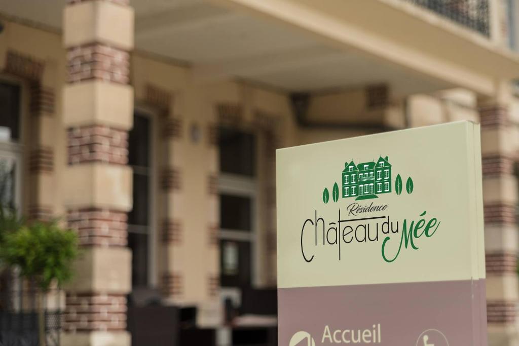 a sign in front of a building at Résidence Château du Mée in Le Mée-sur-Seine
