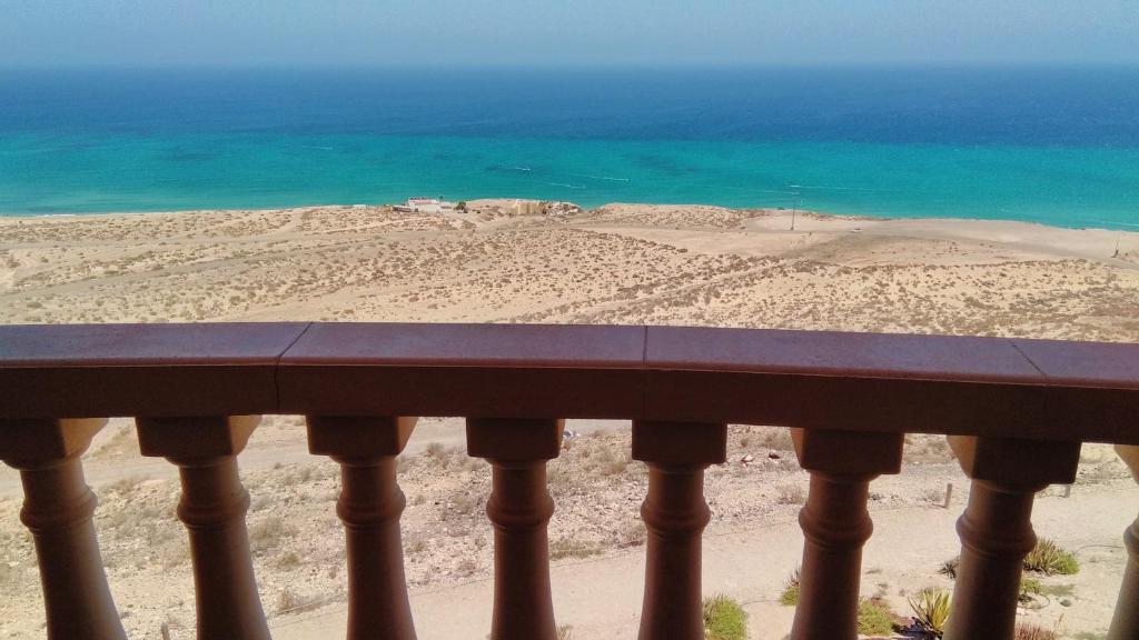 a view of the ocean from a balcony at Relax, descanso y una experiencia inolvidable in Costa Calma