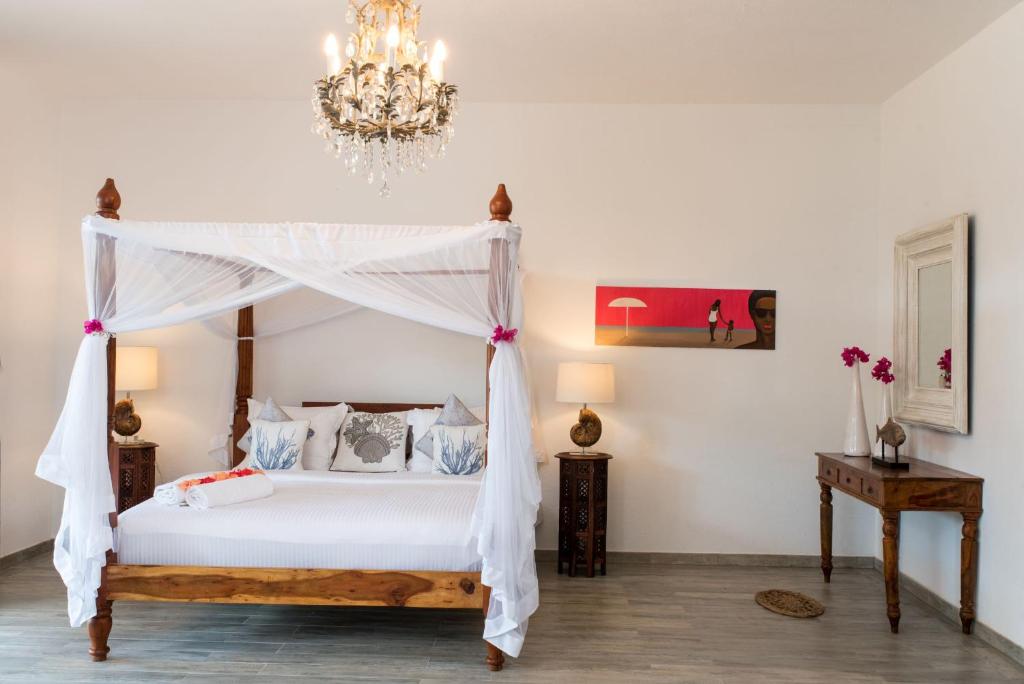 Postel nebo postele na pokoji v ubytování Tikitam Palms Boutique Hotel