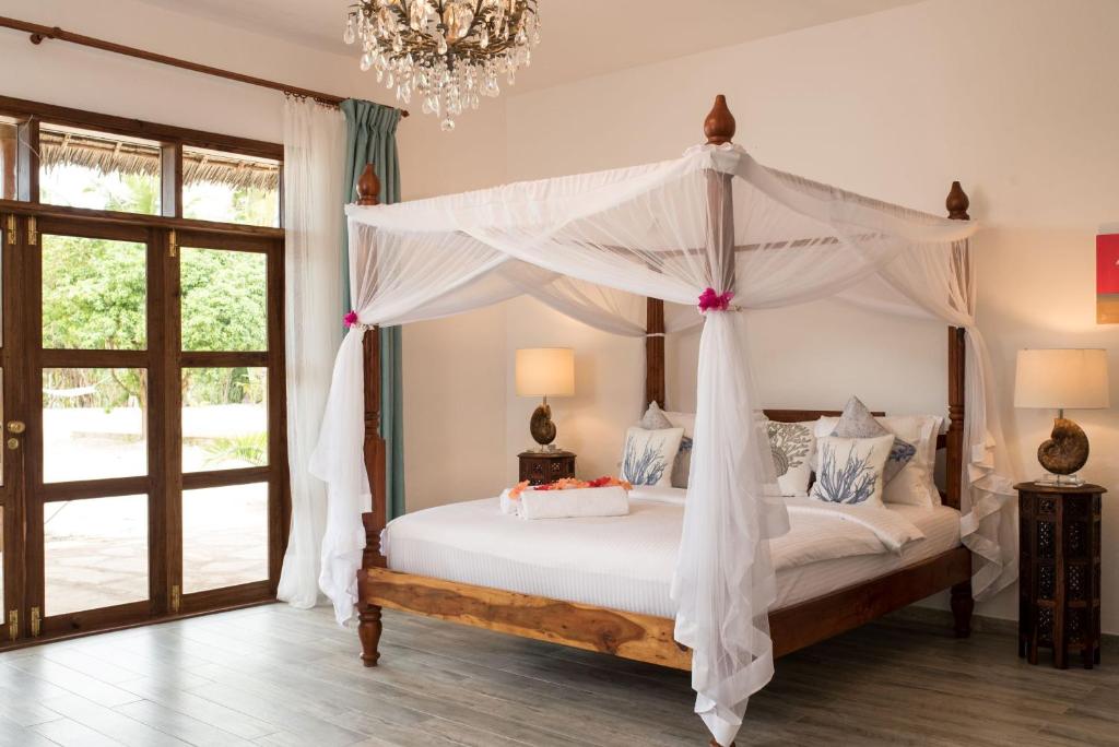 Postel nebo postele na pokoji v ubytování Tikitam Palms Boutique Hotel