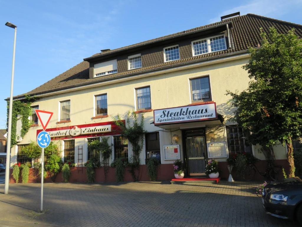 a building on the side of a street at Gasthof Einhaus in Borken