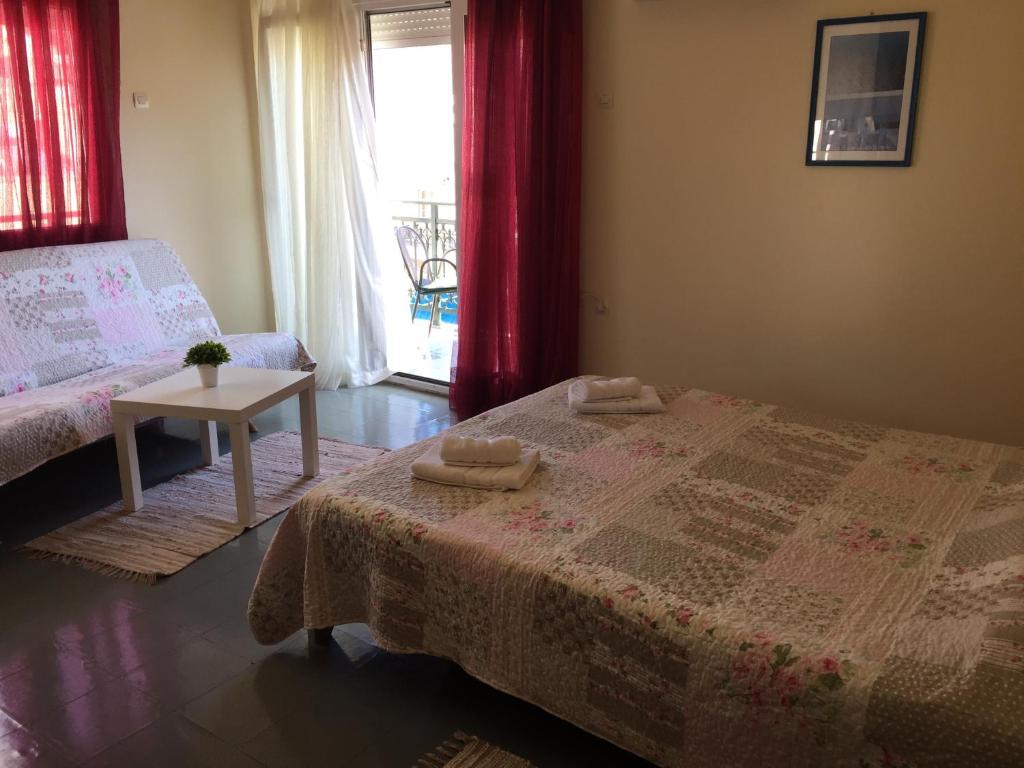 Postel nebo postele na pokoji v ubytování Platanos Rooms