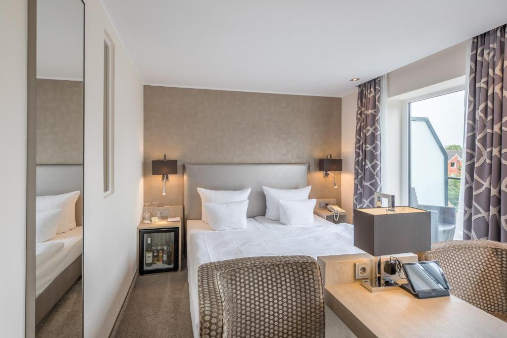 Postel nebo postele na pokoji v ubytování Thomas Hotel Spa & Lifestyle