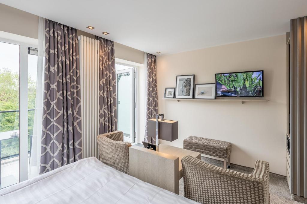 TV a/nebo společenská místnost v ubytování Thomas Hotel Spa & Lifestyle