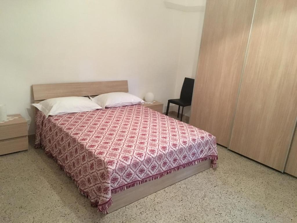 Łóżko lub łóżka w pokoju w obiekcie Casa Vacanze Res Publica Domus