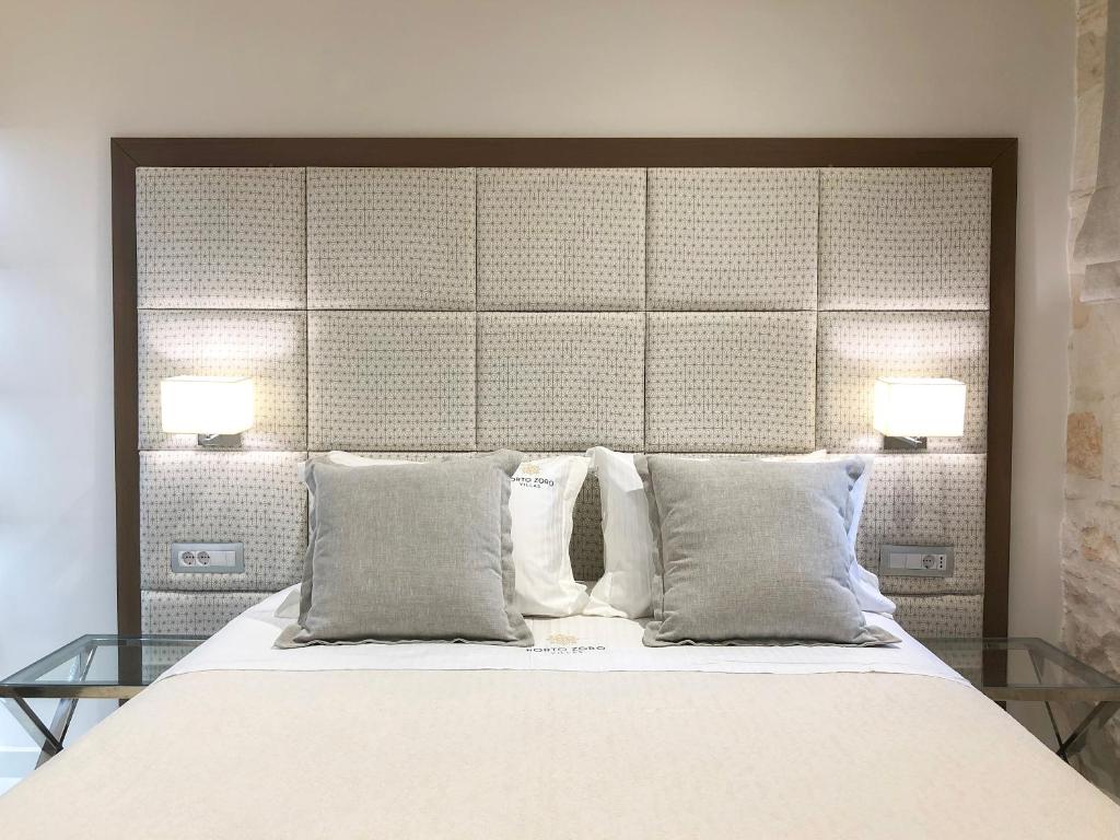 A bed or beds in a room at Porto Vasilikos Villas