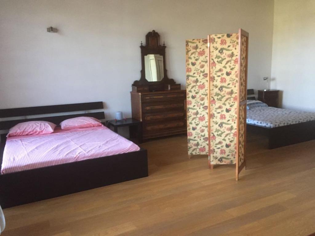 Postel nebo postele na pokoji v ubytování casa in campagna _LORI