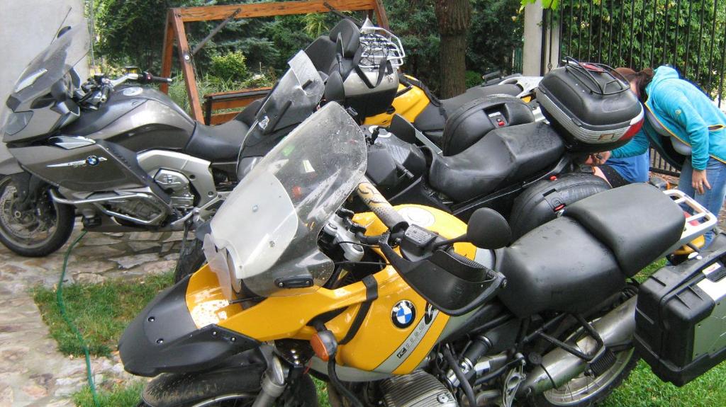 a group of motorcycles parked next to each other at Casa Tomson, free parking, ciubăr, piscină în natura in Oradea