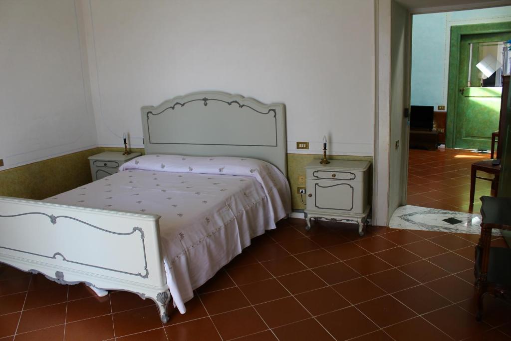Postel nebo postele na pokoji v ubytování Palazzo Bernardini B & B