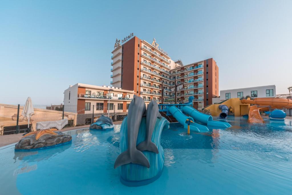 a pool with a water park with a water slide at AZ Hôtels Montana in Mostaganem