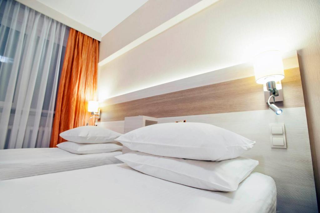 Łóżko lub łóżka w pokoju w obiekcie Comfort by Trio