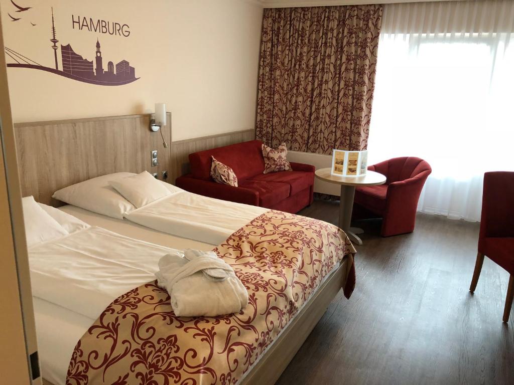 Postel nebo postele na pokoji v ubytování Apartment-Hotel Hamburg Mitte