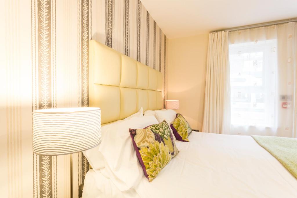 Postel nebo postele na pokoji v ubytování Ethos Hotel