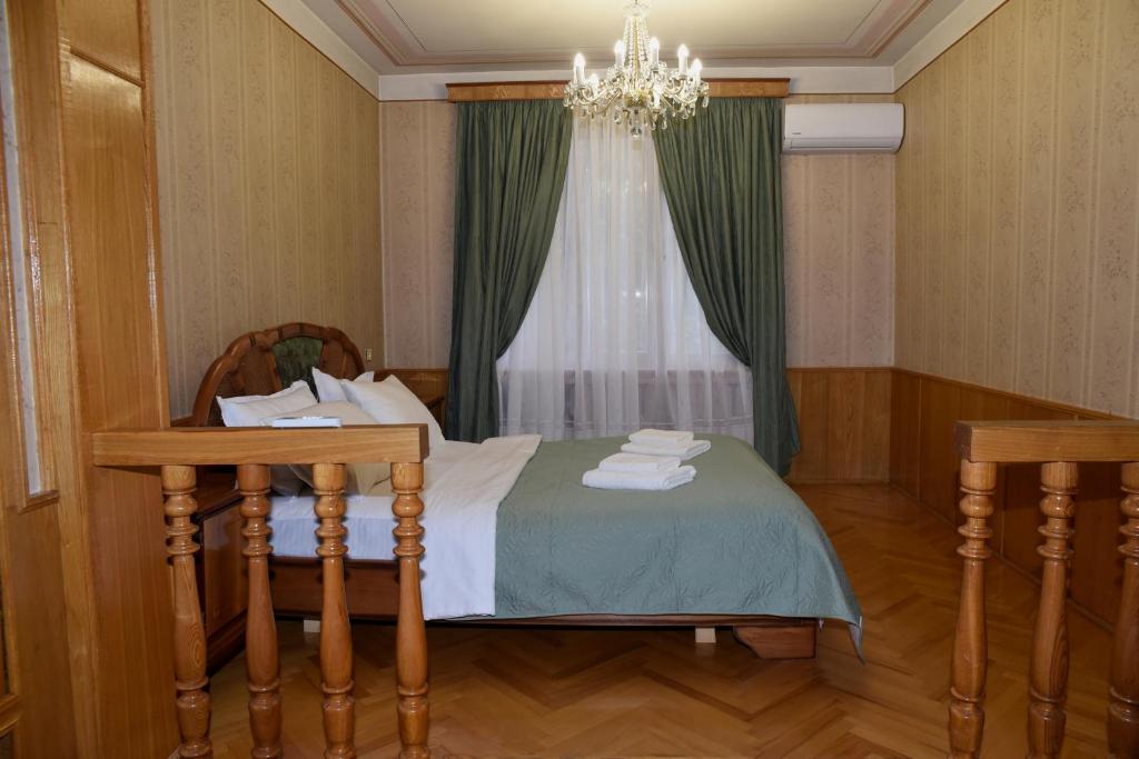 Postel nebo postele na pokoji v ubytování Guest House Kartuli Suli