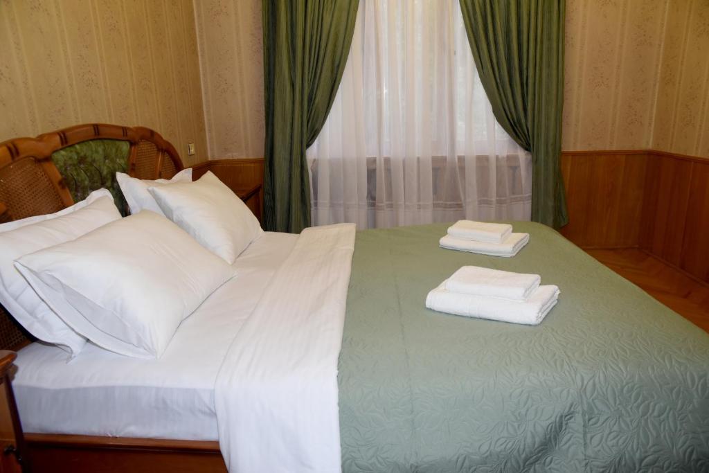Postel nebo postele na pokoji v ubytování Guest House Kartuli Suli