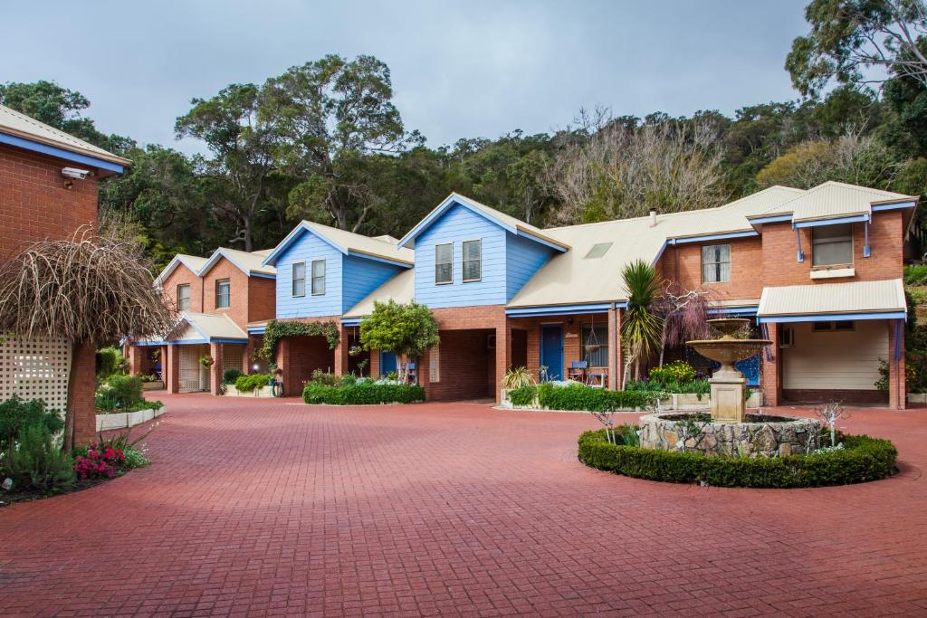 a row of houses with a red brick driveway at Middleton Beach by the BnB Collection in Albany