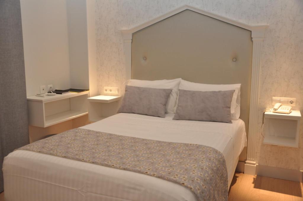 Postel nebo postele na pokoji v ubytování Hotel Selu