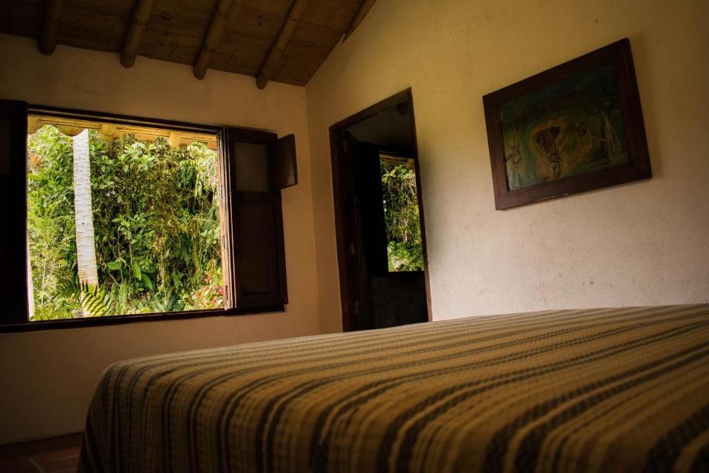 Postel nebo postele na pokoji v ubytování Casa El Cedro