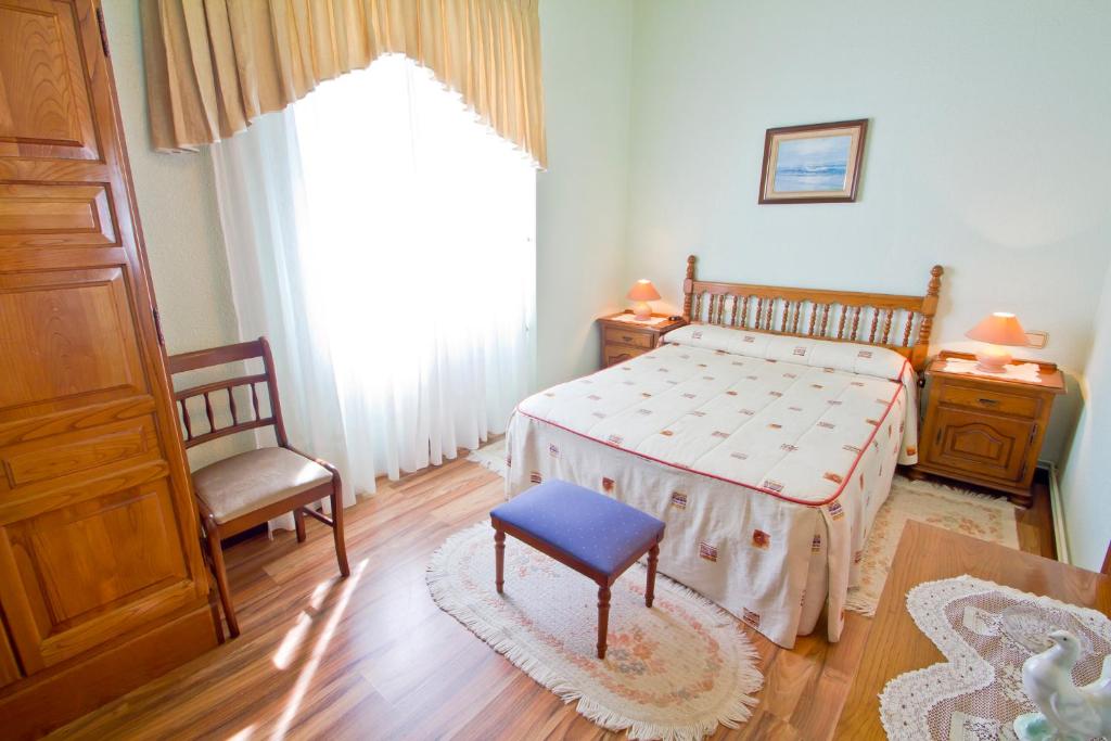 A bed or beds in a room at Hospedaje Roiz