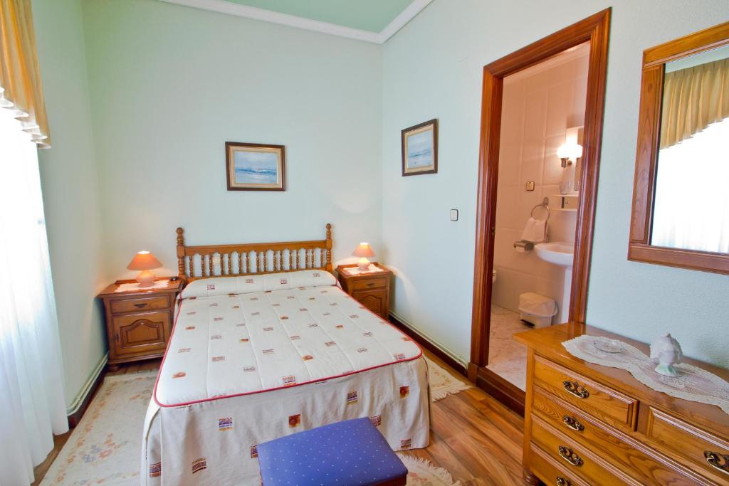 A bed or beds in a room at Hospedaje Roiz