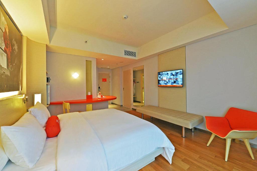 Postel nebo postele na pokoji v ubytování HARRIS Hotel & Conventions Solo