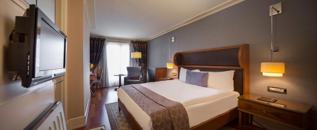Postel nebo postele na pokoji v ubytování Titanic City Taksim