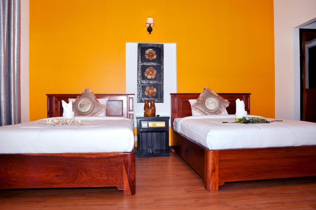 Postel nebo postele na pokoji v ubytování Vimean Sovannaphoum Resort