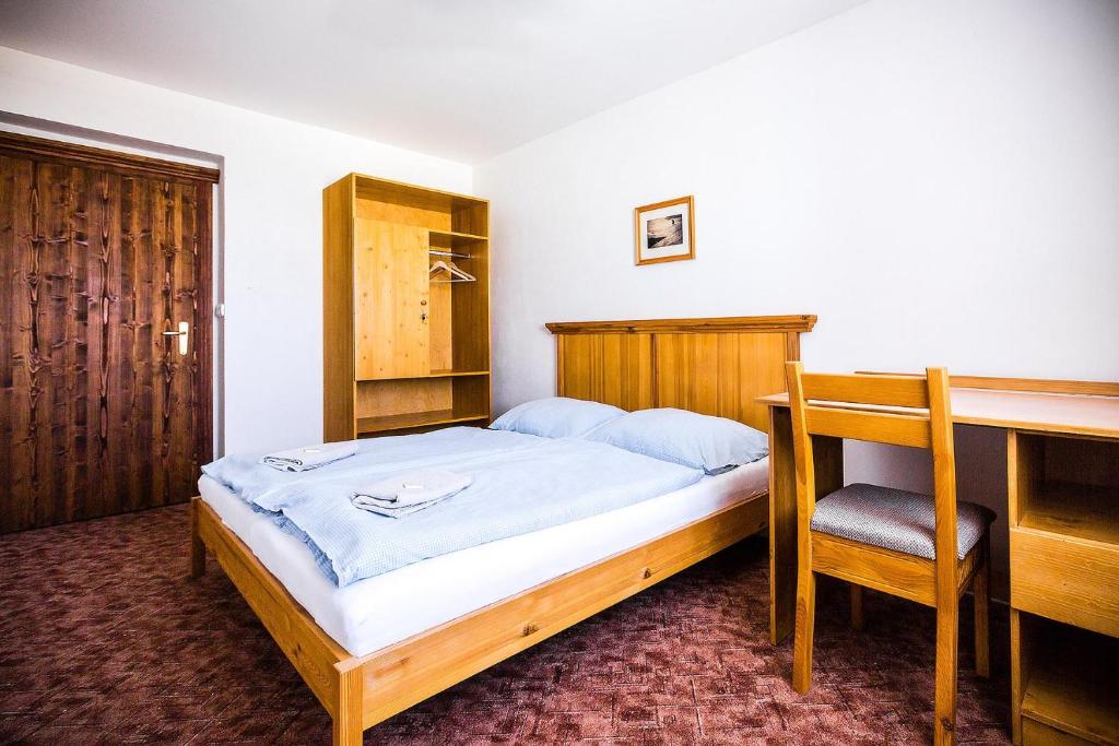 Postel nebo postele na pokoji v ubytování Chata Jiriho na Seraku
