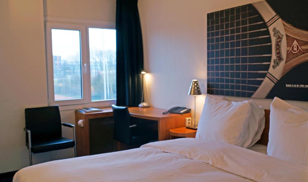 Postel nebo postele na pokoji v ubytování Fletcher Resort-Hotel Zutphen