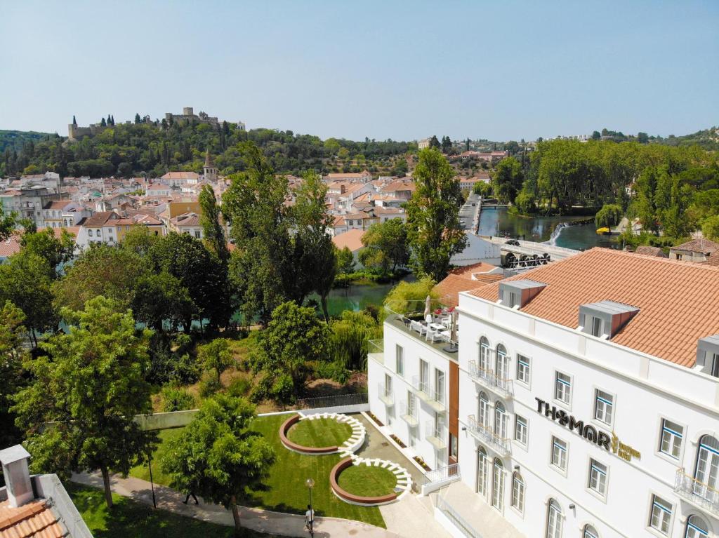 an aerial view of a building and a river at Thomar Boutique Hotel in Tomar