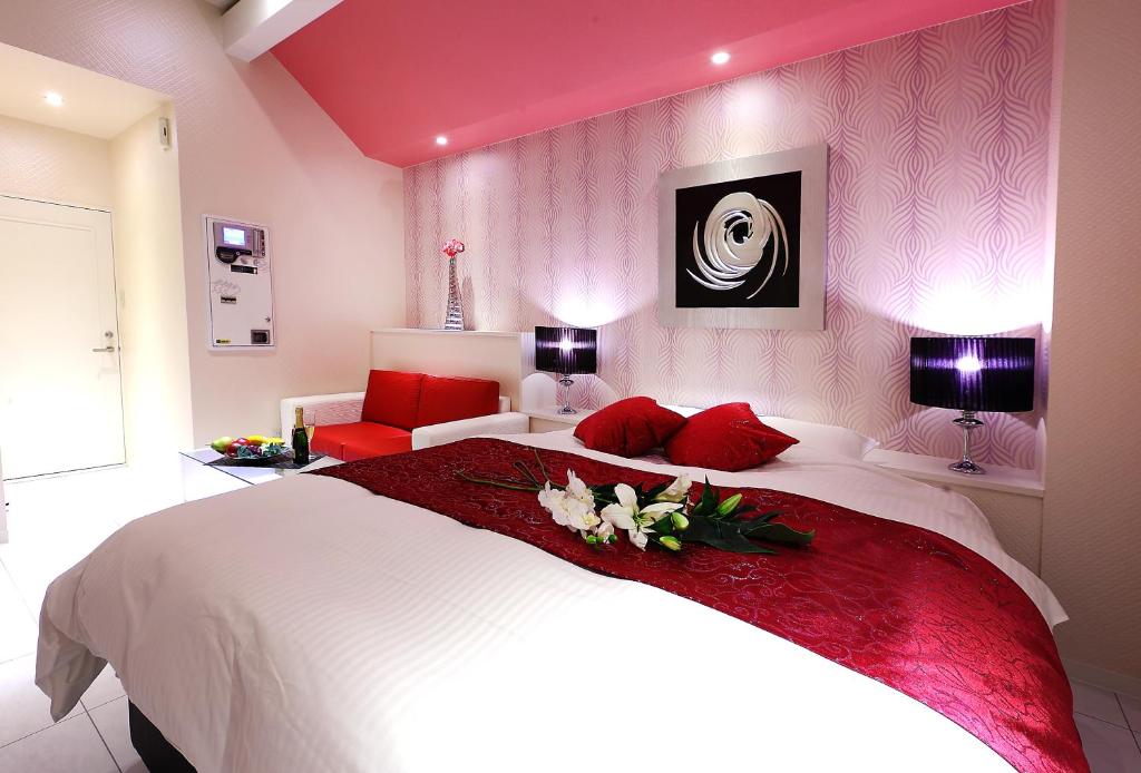 Postel nebo postele na pokoji v ubytování Hotel L'eclair (Adult Only)