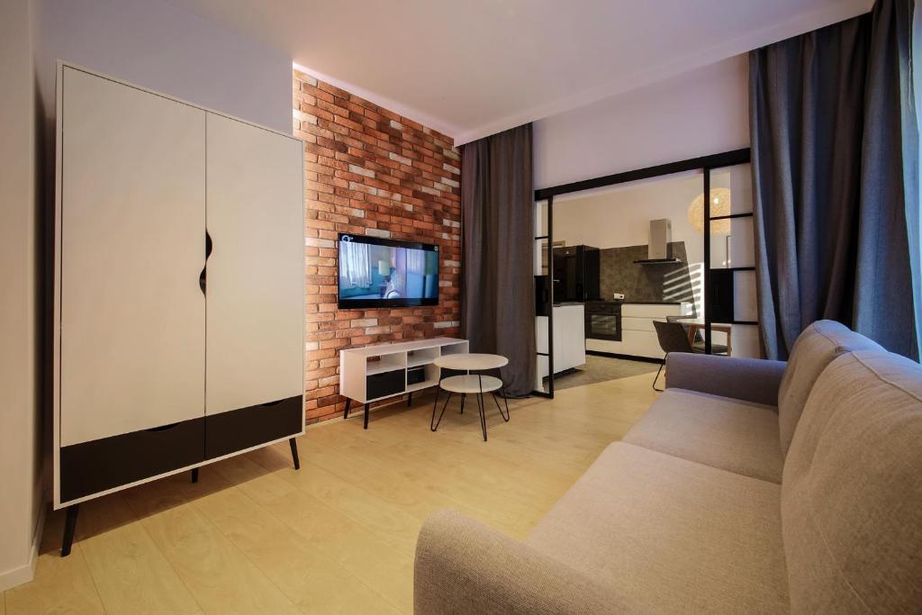 Televízia a/alebo spoločenská miestnosť v ubytovaní Boogie Apartments