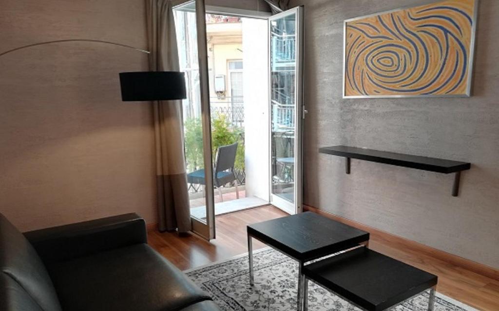 A television and/or entertainment centre at Dharma Luxury Hotel