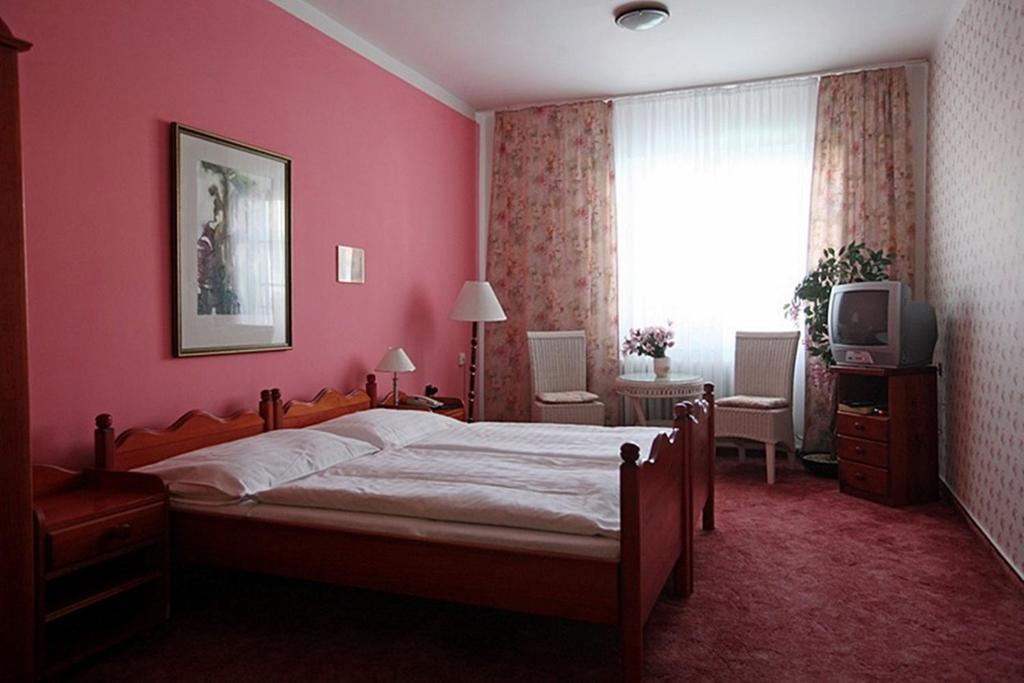 Postel nebo postele na pokoji v ubytování Hotel Solaster Garni