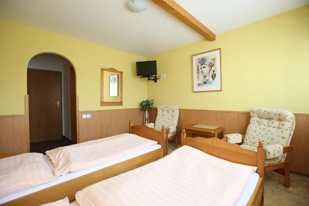 Postel nebo postele na pokoji v ubytování Hotel Solaster Garni