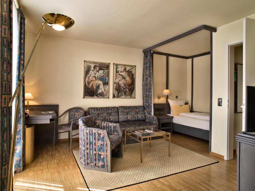 Postel nebo postele na pokoji v ubytování Posthaus Hotel Residenz
